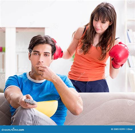 Wife Unhappy that Husband is Watching Boxing Stock Image - Image of