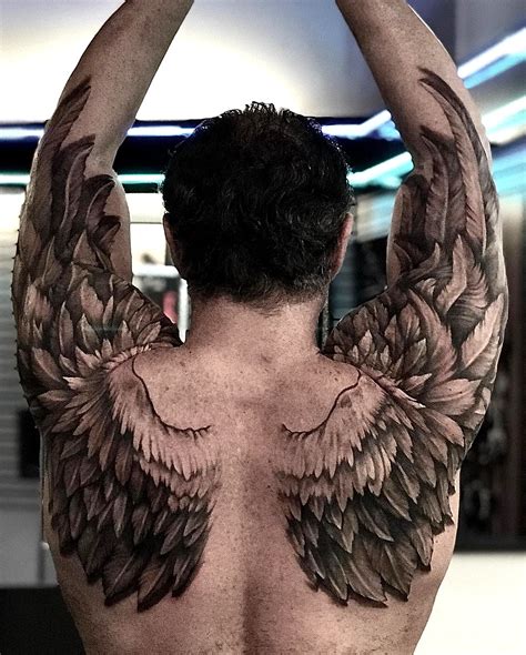 Small angel with wings tattoo designs are the top trend 4