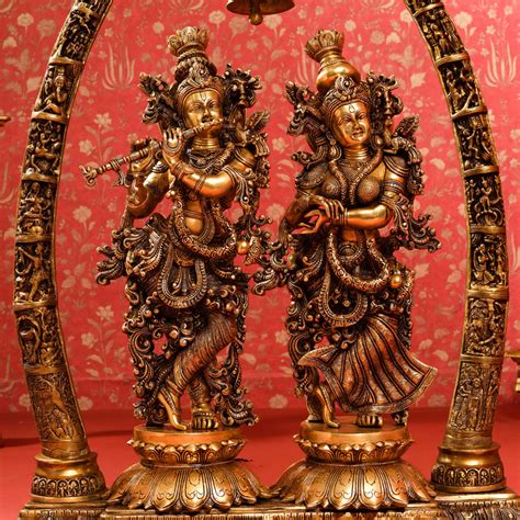 brass superfine radha krishna statue  elephant tusk stand