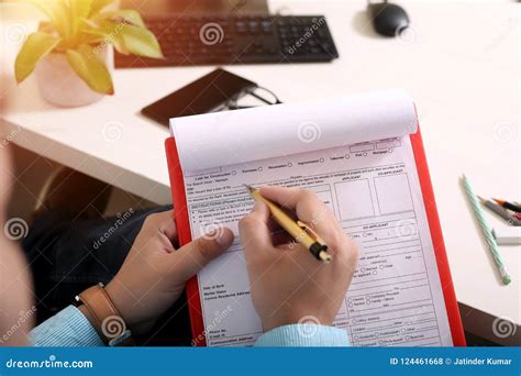 man  filling form   picture  omr sheet   clipboard