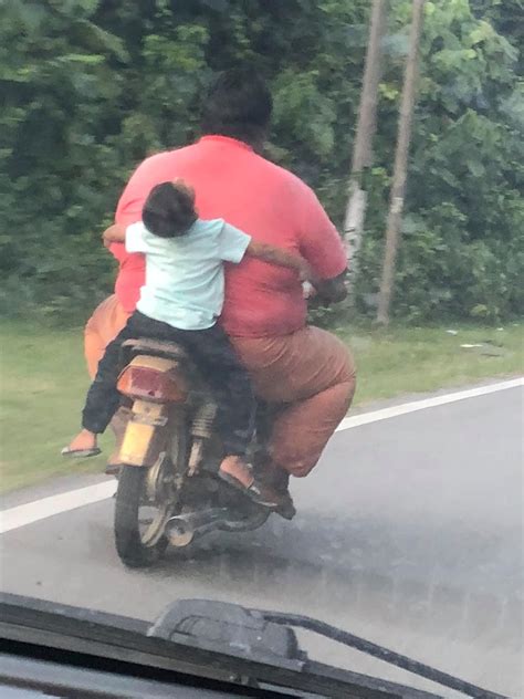 Fat Guy Riding A Scooter