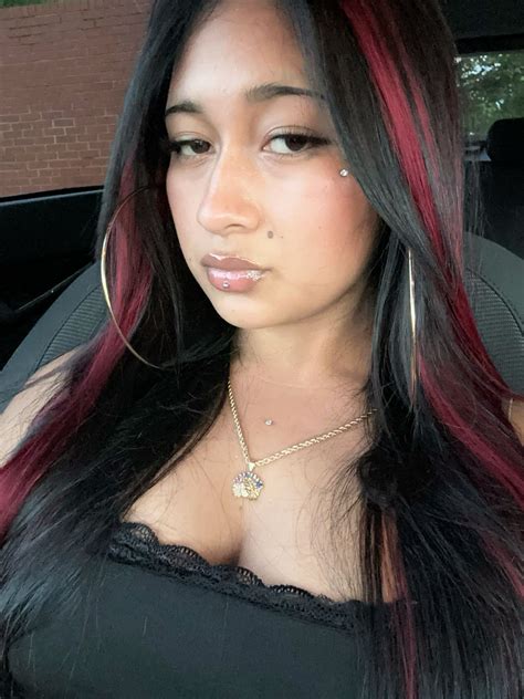 Red highlights on black hair in 2025 | Red hair streaks, Black red hair