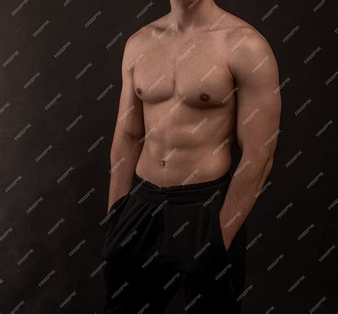 Premium Photo | Aa guy with an athletic figure, with a naked torso