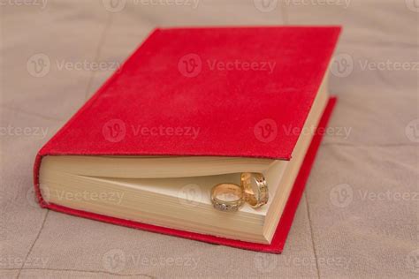 wedding rings in the Red Book 16094508 Stock Photo at Vecteezy