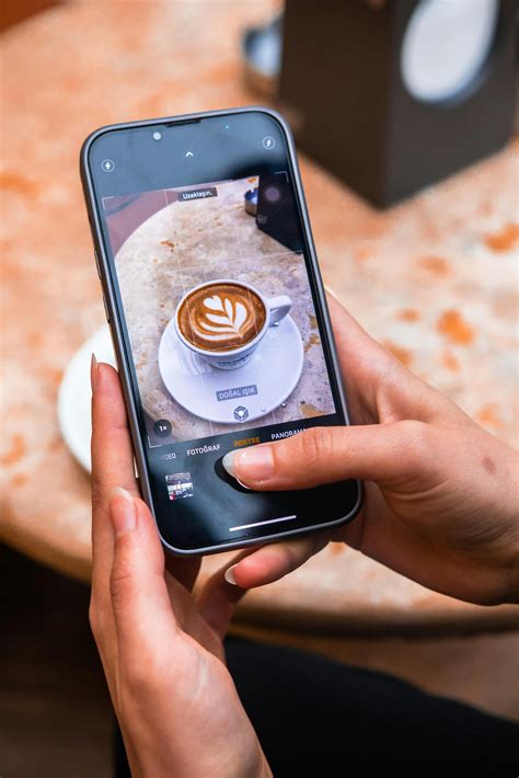 Taking Photos of Latte Art in CafeFree Stock Photo