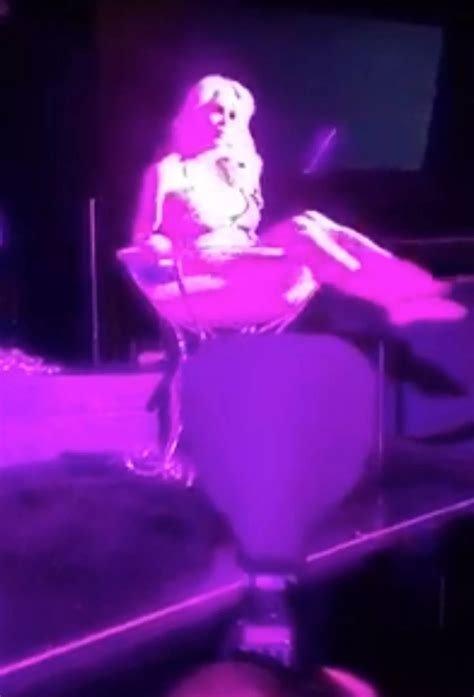 Nearly-naked Frenchy Morgan splashes around in giant cocktail glass as