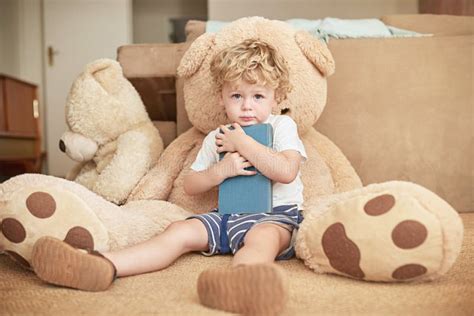 portrait child  hug book  sofa  house  learning literature