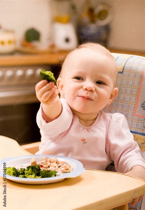 baby eating lunch Stock Photo | Adobe Stock