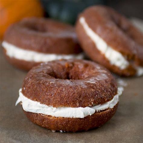 A pumpkin donut filled with a creamy, sweetened cream cheese filling ...