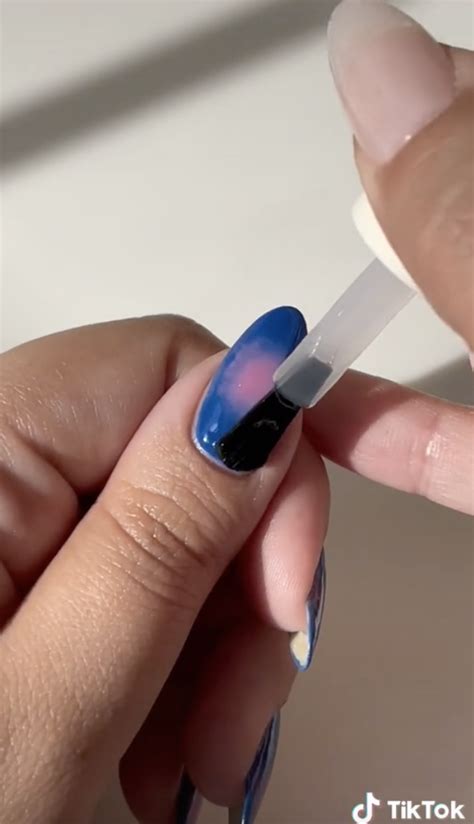 Here's What To Know About Aura Nails - theFashionSpot