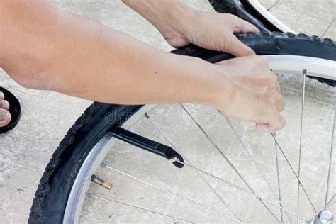 Man change tire for bike stock photo. Image of grunge - 126311550