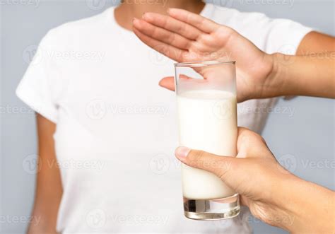 Lactose Intolerance. Unrecognizable Girl Gesturing No To Glass Of Milk