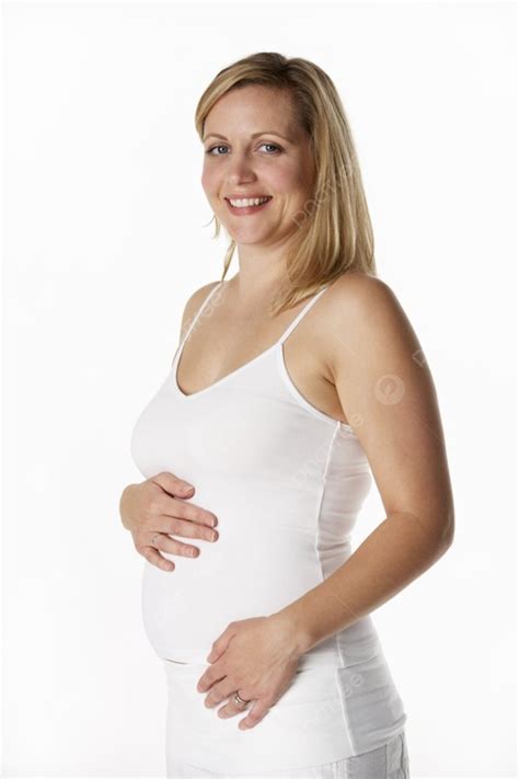 Studio Portrait Of 4 Months Pregnant Woman Wearing White Background