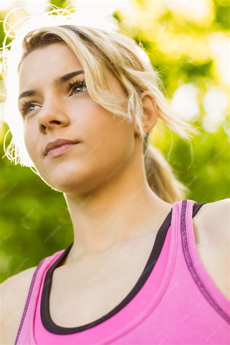 Premium Photo | Fit blonde standing in the park