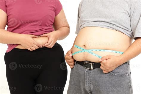 Fat Asian women and man use a Blue tape measure. Measure your belly