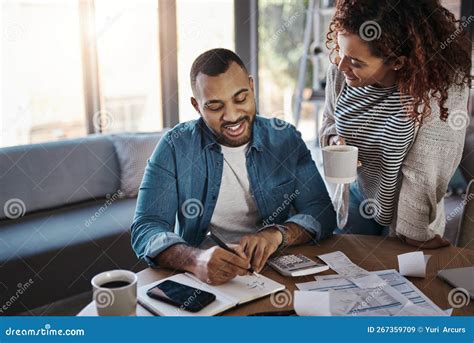 Lets Work this Budget Like a Boss. a Young Couple Planning Their Budget ...