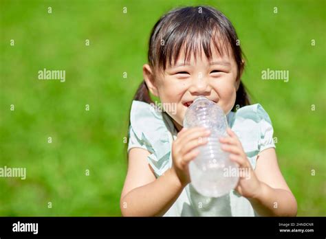 Japanese Girl Drinking Water Stock Photo - Alamy