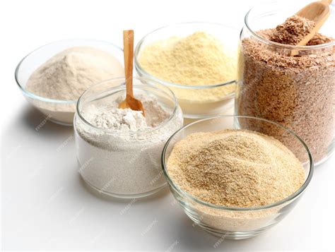 Premium Photo | Different types of flour in bowls isolated on white