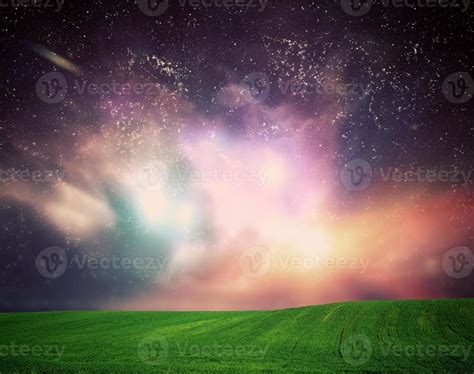 Field of grass under dream galaxy sky, space, glowing stars. 7842896