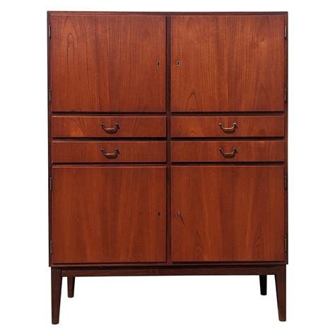 Mid Century Danish Modern Tall Narrow Cabinet with 5 drawers by Aksel