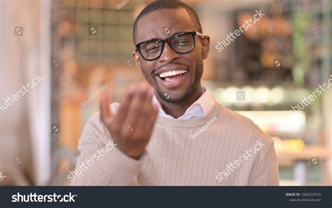 portrait assertive african man inviting people stock photo