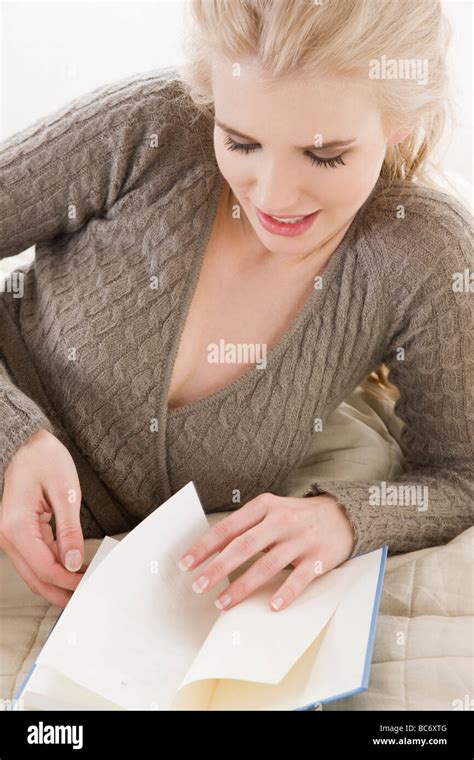 young woman reading in bed Stock Photo - Alamy