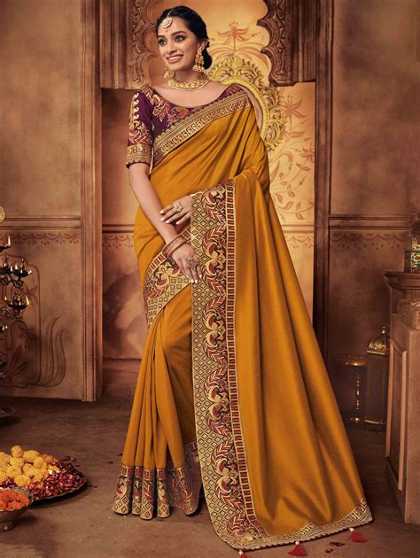 Mustard Silk Plain Saree with Peacock Motif Embroidered Border in 2020