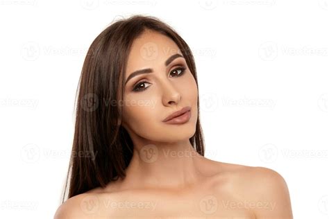 Close up portrait of a brunette nude model girl with professional