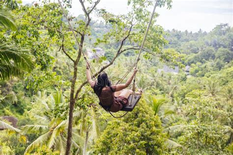 young tourist woman swinging   tropical rainforest  bali