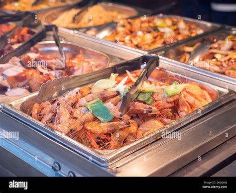 Chinese food on display in a chinese restaurant window, served in a ...