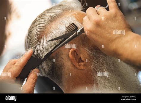 hairdresser making stylish haircut   man stock photo alamy