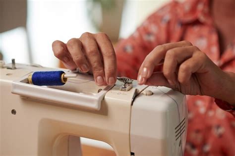 premium photo seamstress preparing sewing machine