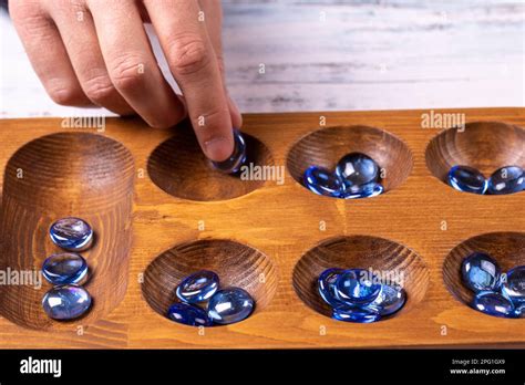 Mangala game board and glass marbles. Historical Turkish game mangala ...