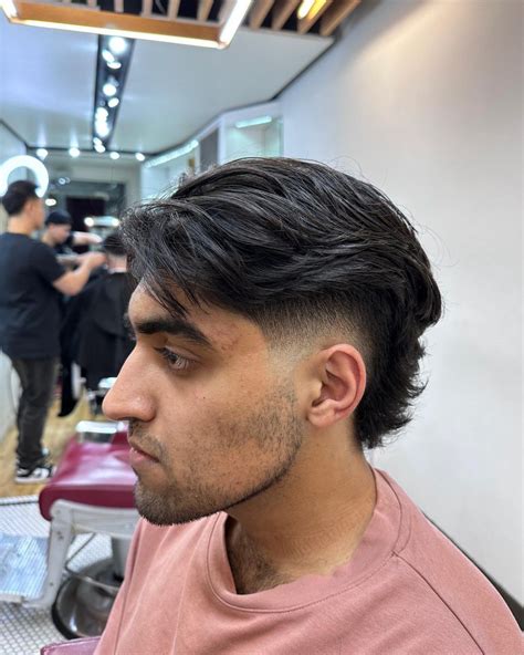 Barbers debate the low taper fade middle part resurgence online 36