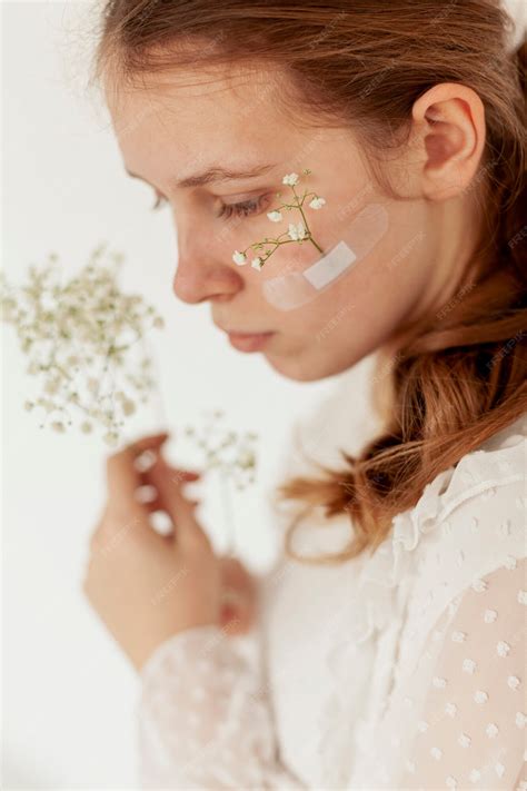 Free Photo | Woman with flowers on face