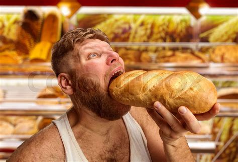 man eating bread   shop stock image colourbox