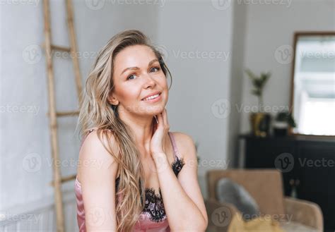 Beauty portrait of blonde smiling woman 35 year clean fresh face and