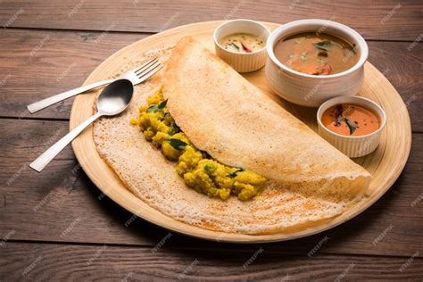 Premium Photo | Masala dosa is a south indian meal served with sambhar ...