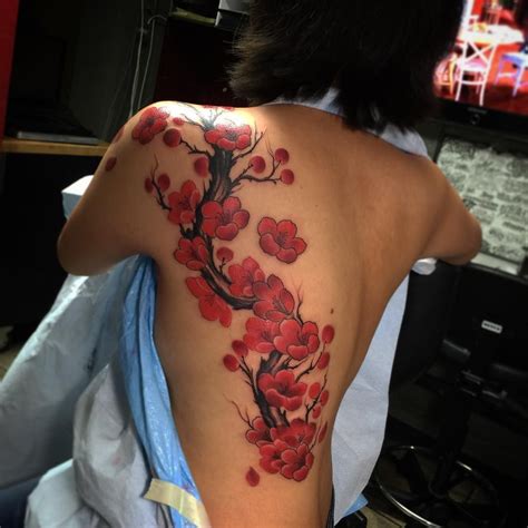 a woman with a tattoo on her back