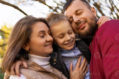 photographs of a happy traditional family close-up portrait of mom dad