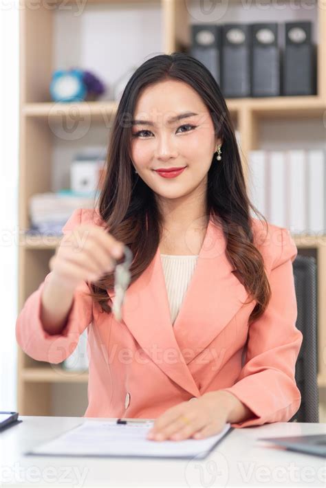 businesswoman runs real estate brokerage business and is offering her