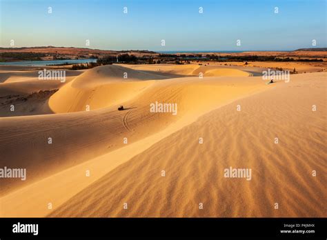 Sand dunes on sunset near Mui Ne or Phan Thiet city in Vietnam Stock ...