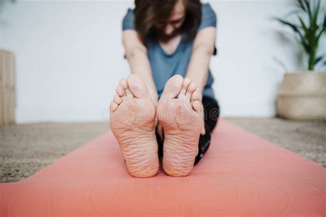 Close Up of Mature Caucasian Senior Woman Practicing Yoga Pose at Home