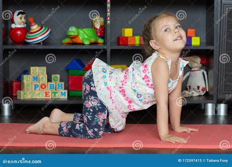 Little Girl Making Yoga Cat or Cow Pose Stock Image - Image of ...