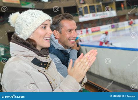 couple cheering   ice hockey team stock image image  indoor