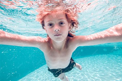 premium photo underwater view  kid  naked torso   swimming