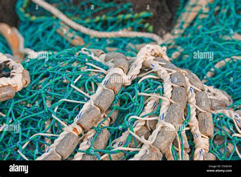 Pacific herring purse seine net and lead line on stack on fishing boat ...