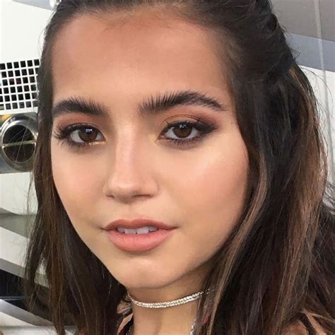 a woman with long hair wearing a choker
