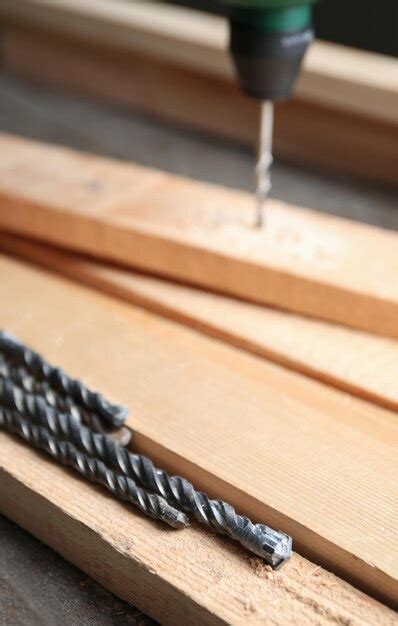 premium photo set  drills  wooden boards  table  carpenters