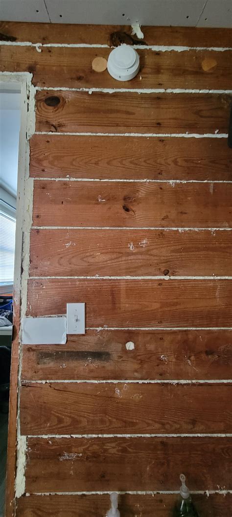 Ripped off wood paneling to find this in between the original house and